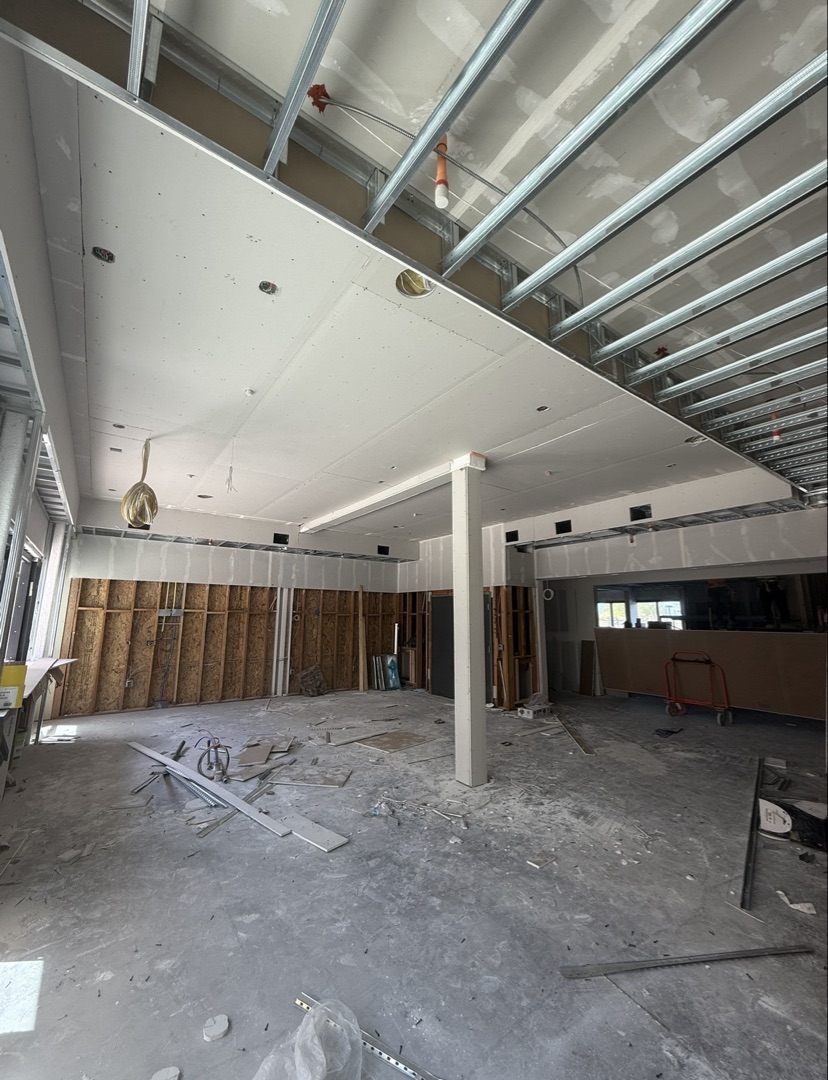 Drywall installation progress on a luxury apartment complex